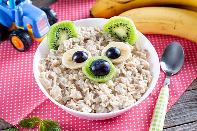 oatmeal with fruit that looks like an animal face