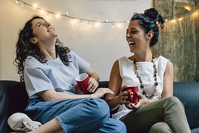 friends laughing and drinking tea