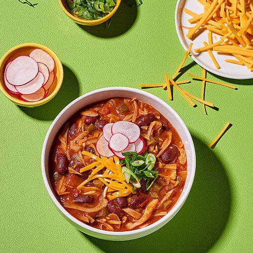 jackfruit chili with radishes, cheese, and fresh herbs
